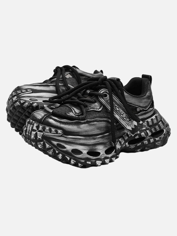 Chunky black sneakers with tire sole design by TALISHKO, perfect for bold street style.