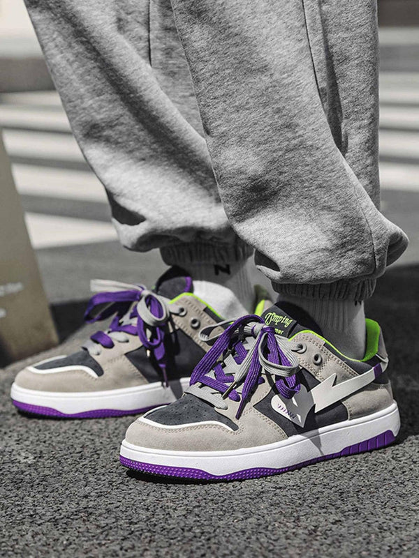 TALISHKO retro casual shoes in gray with purple accents, showcased on a model in street style.