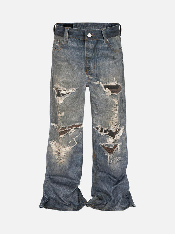 Front view of blue TALISHKO flare jeans featuring retro wash and distressed detailing.
