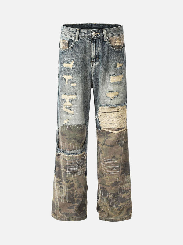 Front view of TALISHKO's blue baggy jeans with ripped camouflage patchwork detailing.