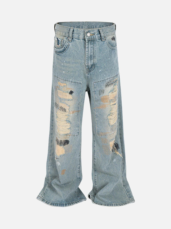 Front view of blue ripped distressed baggy flare jeans by TALISHKO, showcasing unique street style.