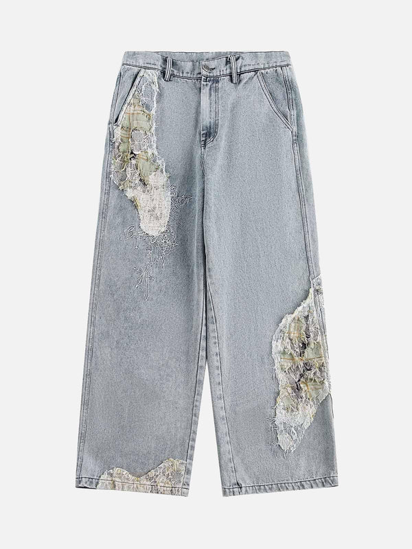 Front view of light blue ripped lace panel denim pants by TALISHKO, perfect for edgy style.