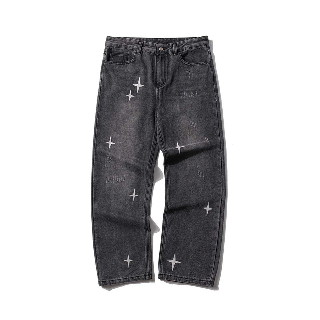 Front view of black shredded raw jeans with star details by TALISHKO, perfect for edgy style.