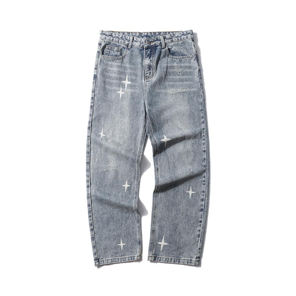 Front view of blue shredded raw jeans with star patterns by TALISHKO, offering a bold look.