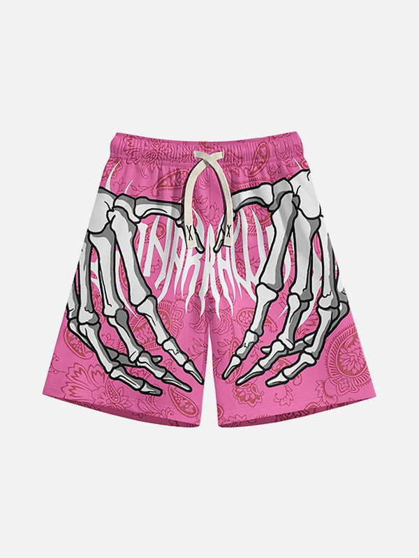Front view of pink hip-hop shorts by TALISHKO, featuring a bold skeleton hand design.