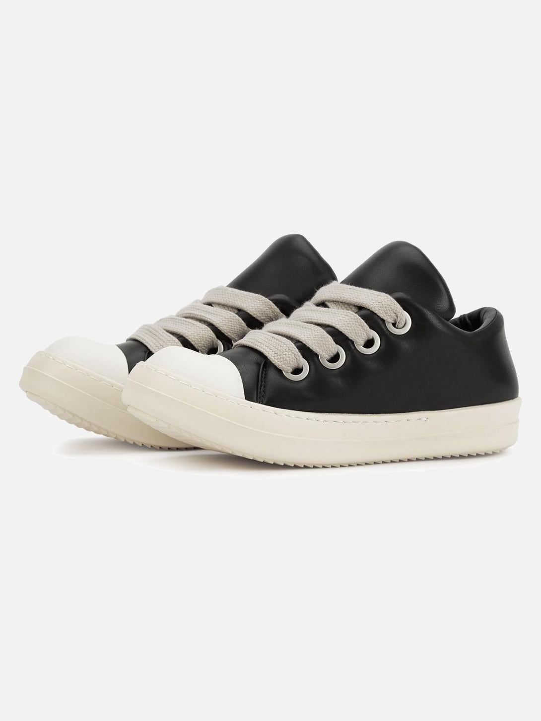 TALISHKO black slip-on sneakers with white soles and wide laces, perfect for street style.