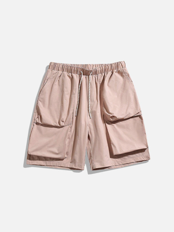Front view of pink drawstring shorts by TALISHKO, featuring large pockets for casual wear.