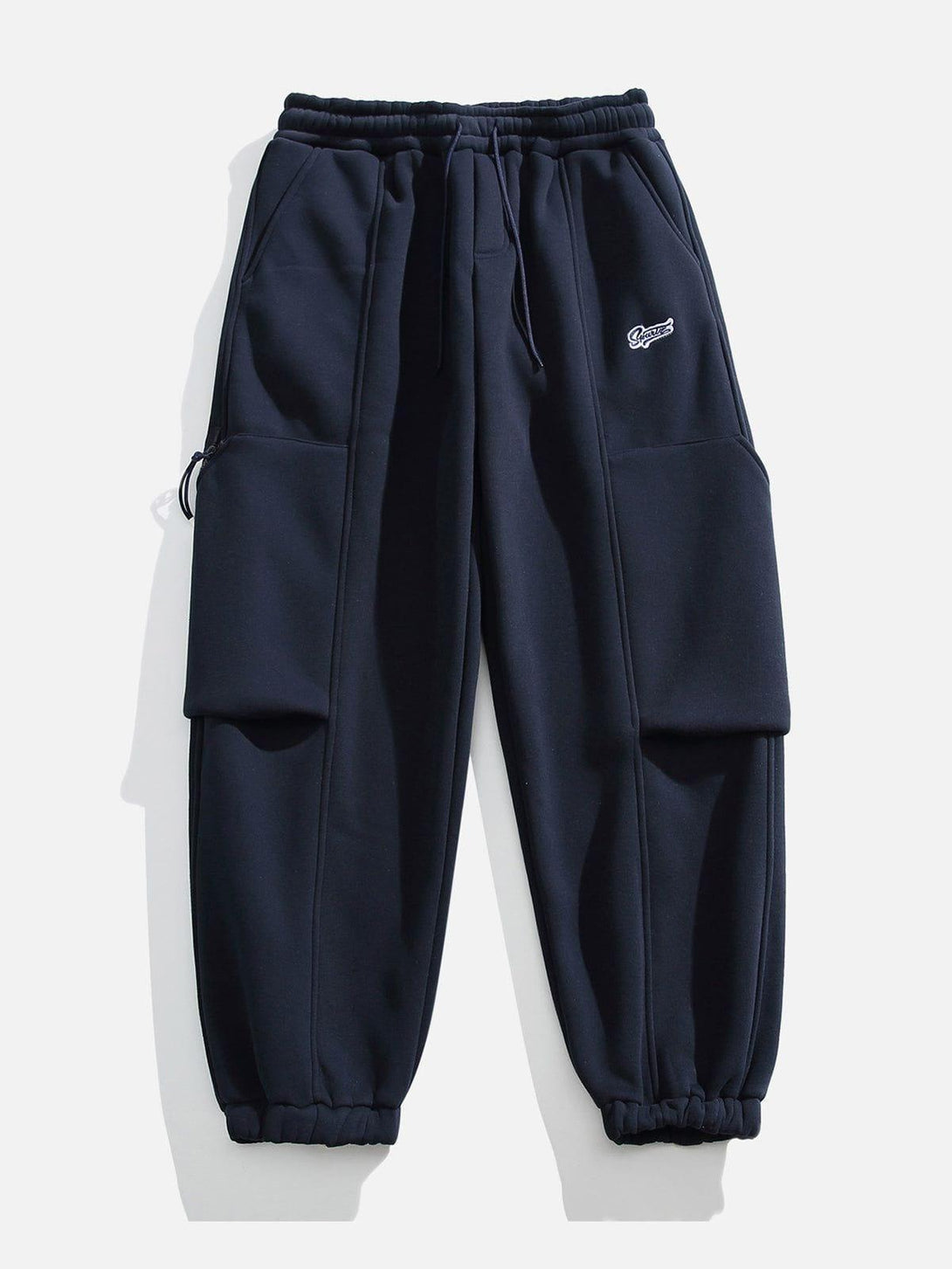 Navy joggers with large pockets by TALISHKO, front view, embodying casual urban style.