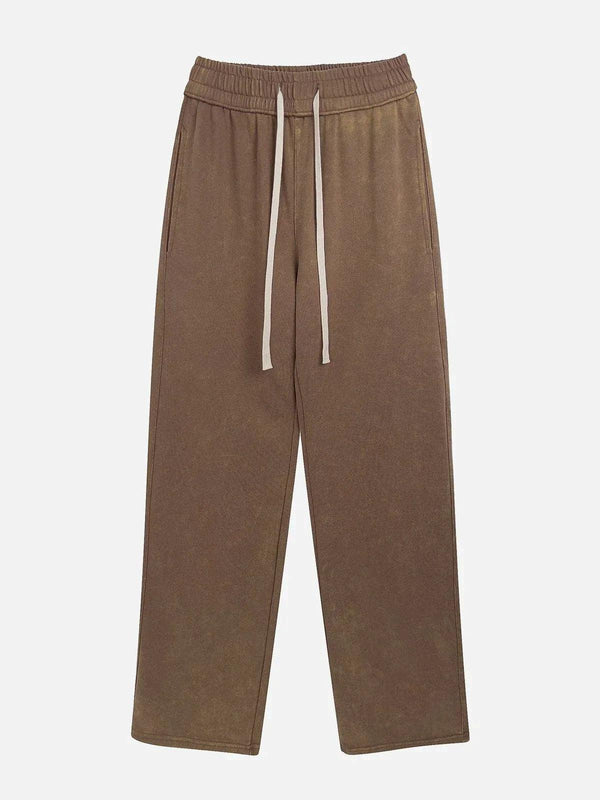 Front view of khaki drawstring pants by TALISHKO, featuring a relaxed streetwear style.