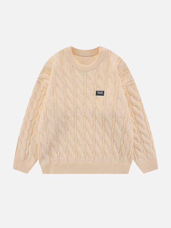 Front view of apricot twist knit sweater by TALISHKO, showcasing its cozy cable-knit design.