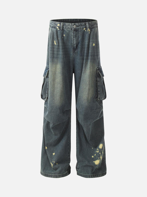 Front view of dark blue spray-painted cargo jeans by TALISHKO, featuring pleated details.
