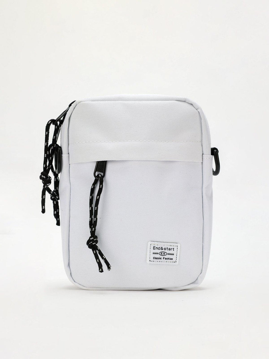 Front view of a white square crossbody bag by TALISHKO, featuring stylish rope details.