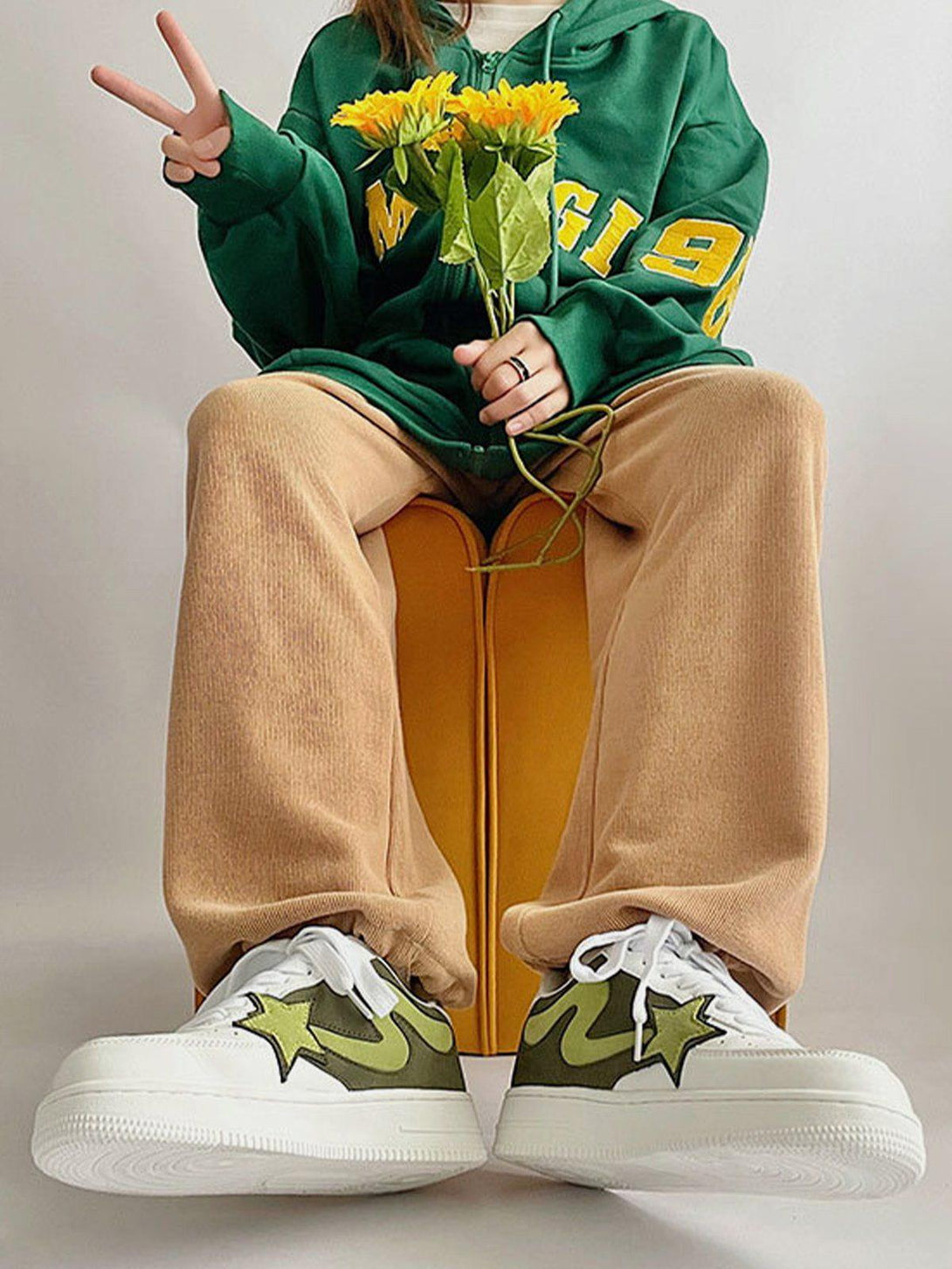 TALISHKO sneakers in a casual street style, featuring green star accents and a cozy fit.