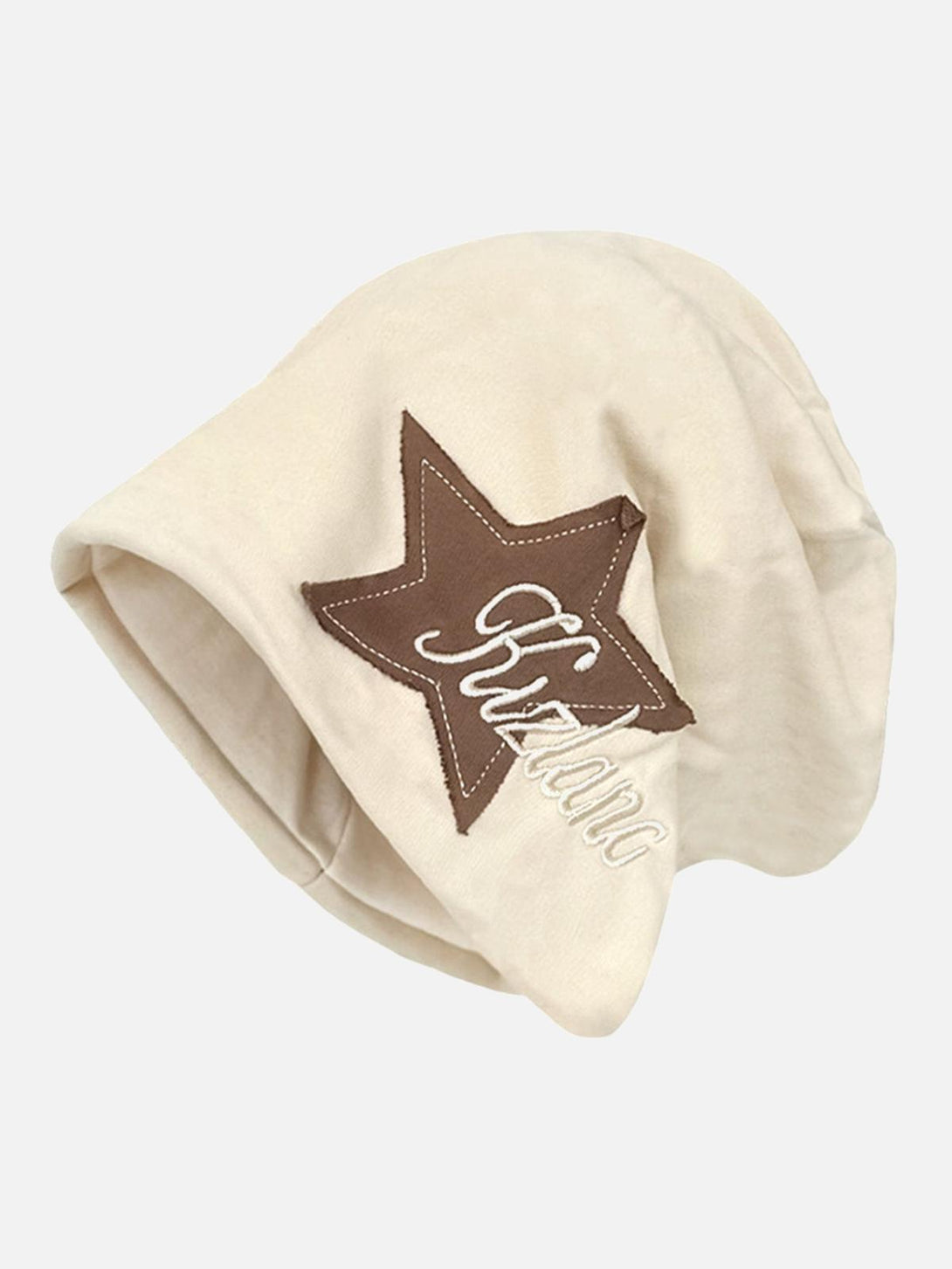 Floral white wrap hat with star embroidery by TALISHKO, adding a chic touch to any urban look.