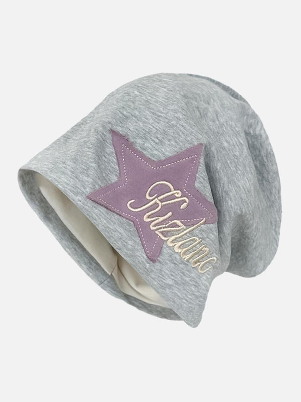 Light gray wrap hat with star embroidery by TALISHKO, showcasing a trendy street style.