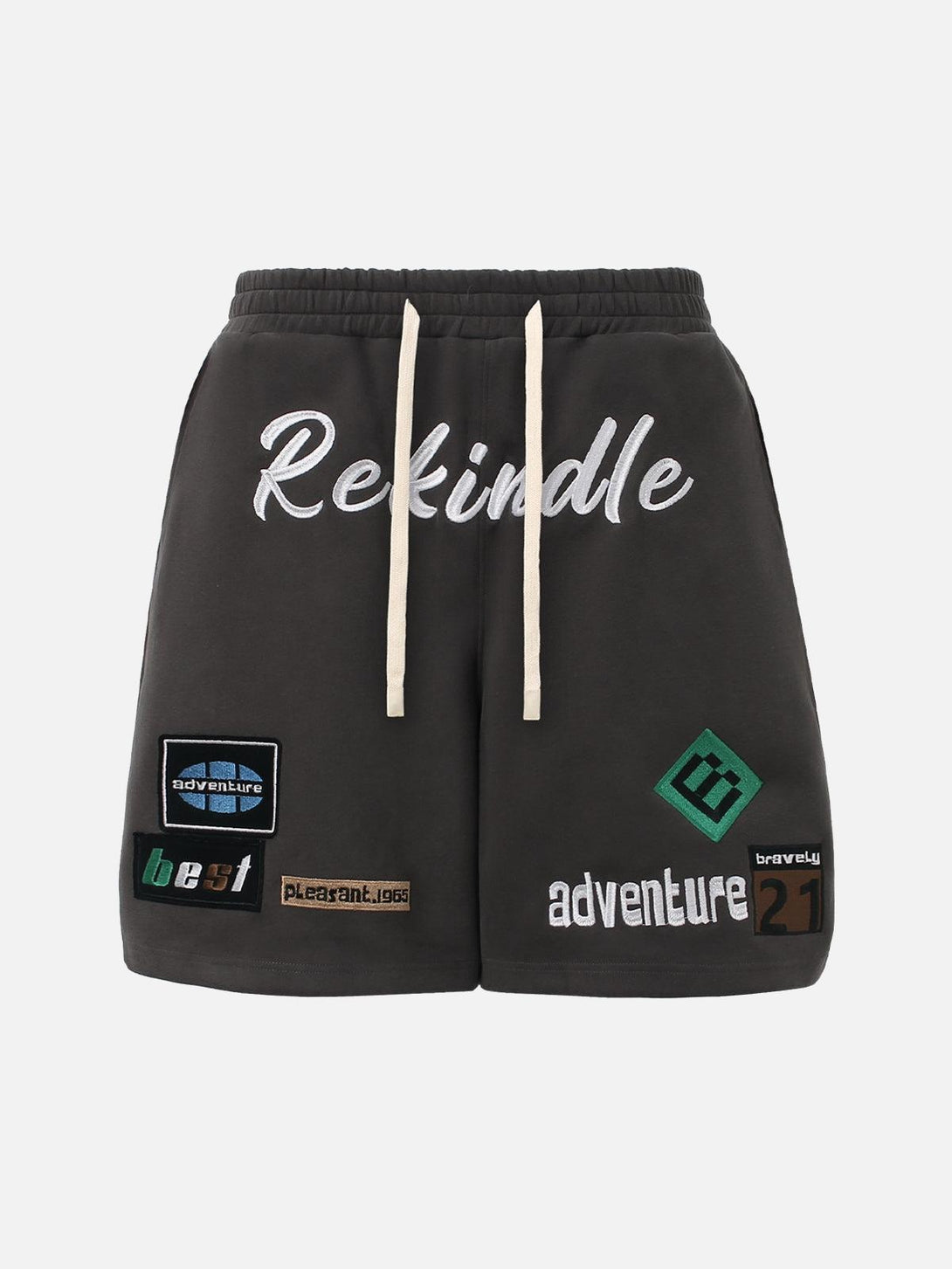 Front view of brown TALISHKO drawstring shorts with graphic patches and text details.