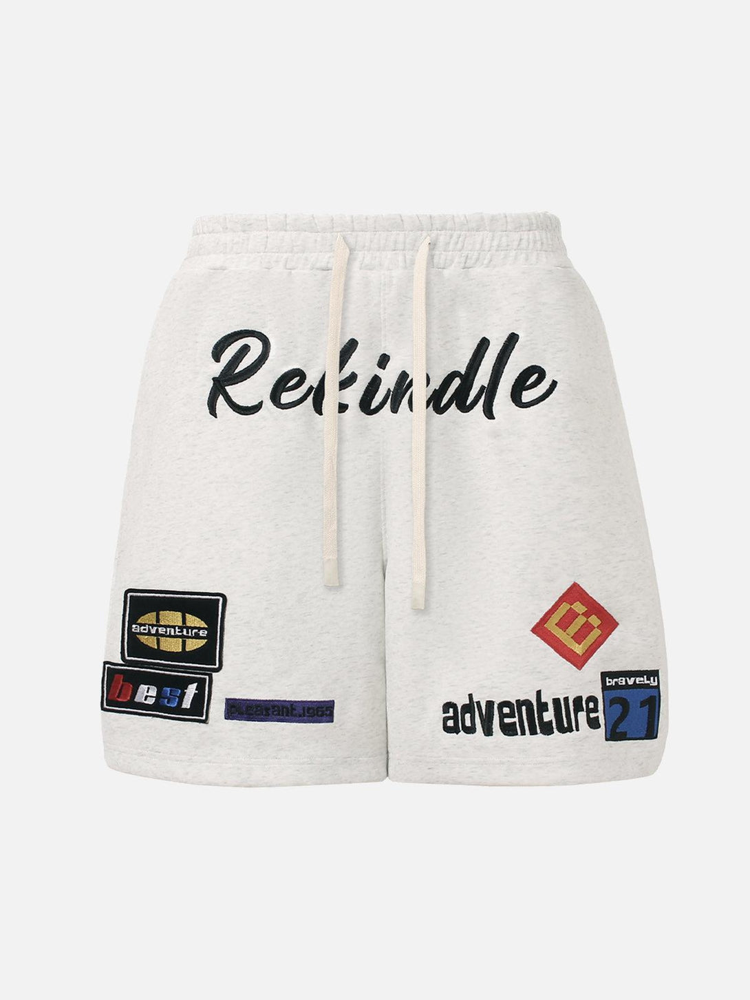 Front view of white graphic drawstring shorts by TALISHKO, featuring bold patches and text.