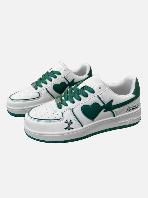 Green and white skate shoes by TALISHKO, featuring heart design and stylish streetwear flair.
