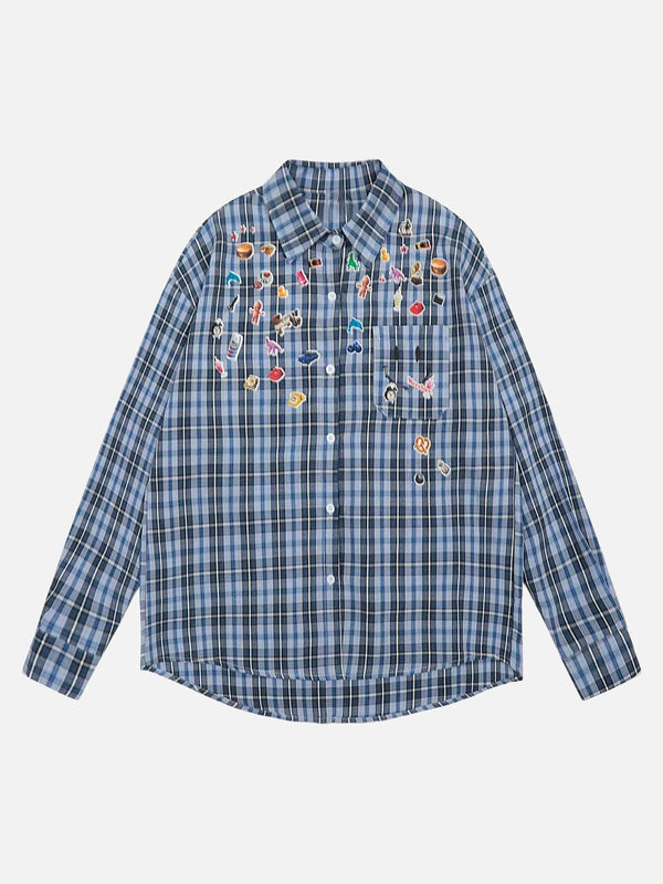 Front view of a blue plaid shirt with playful embroidery details by TALISHKO.