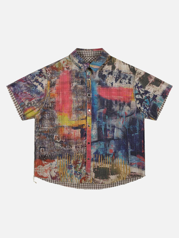 Front view of a colorful, short-sleeved shirt by TALISHKO, showcasing vibrant street art patterns.