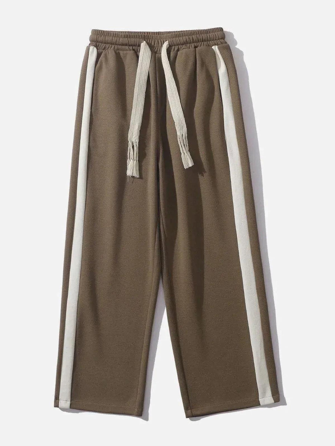 Front view of brown striped patchwork pants by TALISHKO, featuring a relaxed fit and drawstring.