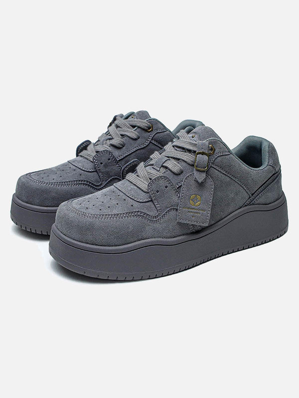 Gray suede low-top skate shoes by TALISHKO in a front view, perfect for urban style.