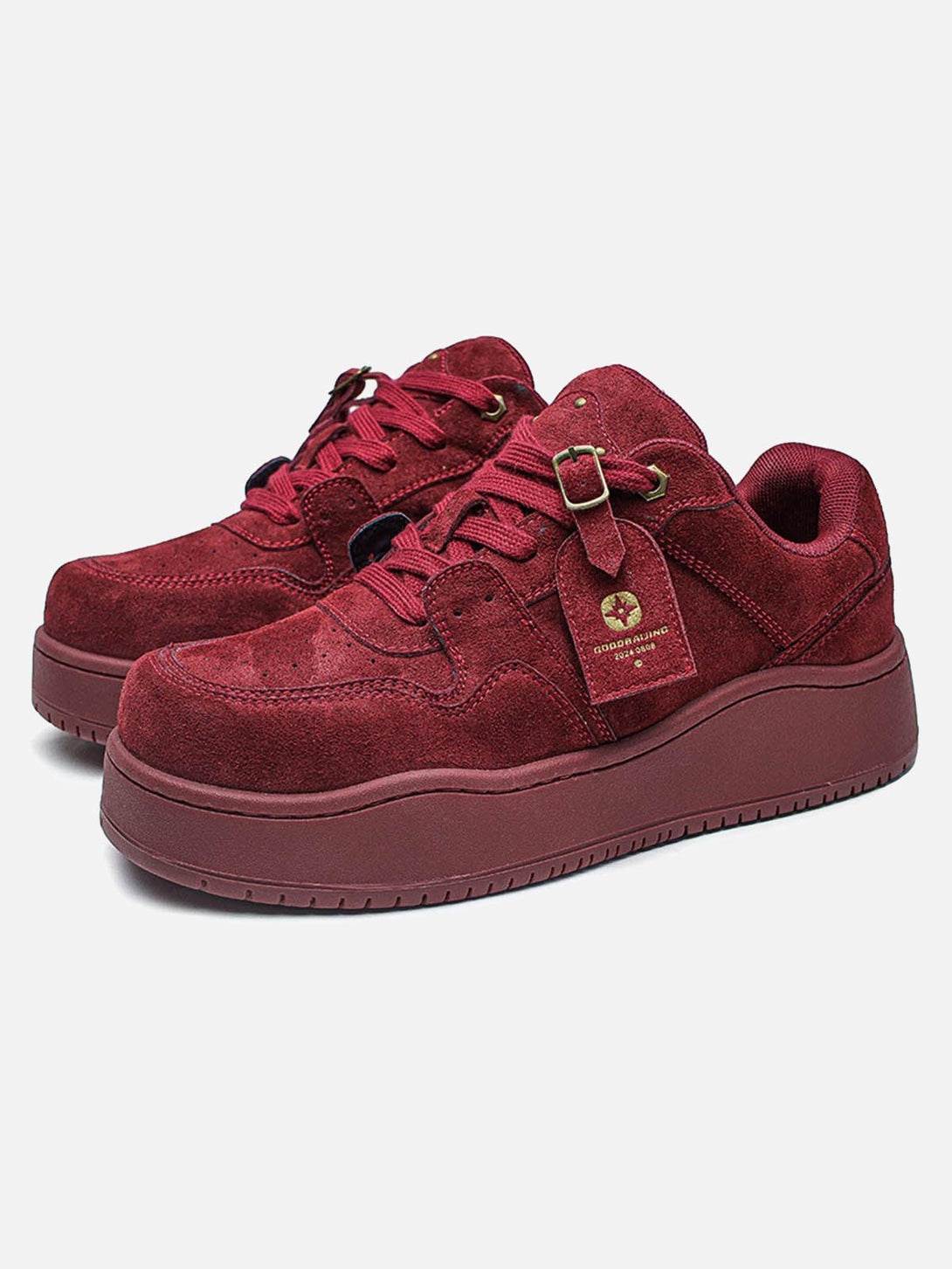 Stylish wine red suede low-top skate shoes by TALISHKO, showcased in front view.
