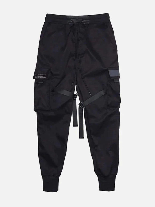 Front view of black tactical utility joggers by TALISHKO, featuring unique straps and pockets.