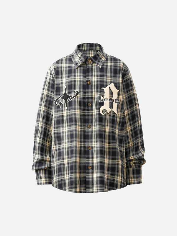 Front view of a blue plaid shirt with towel embroidery, designed by TALISHKO for casual style.