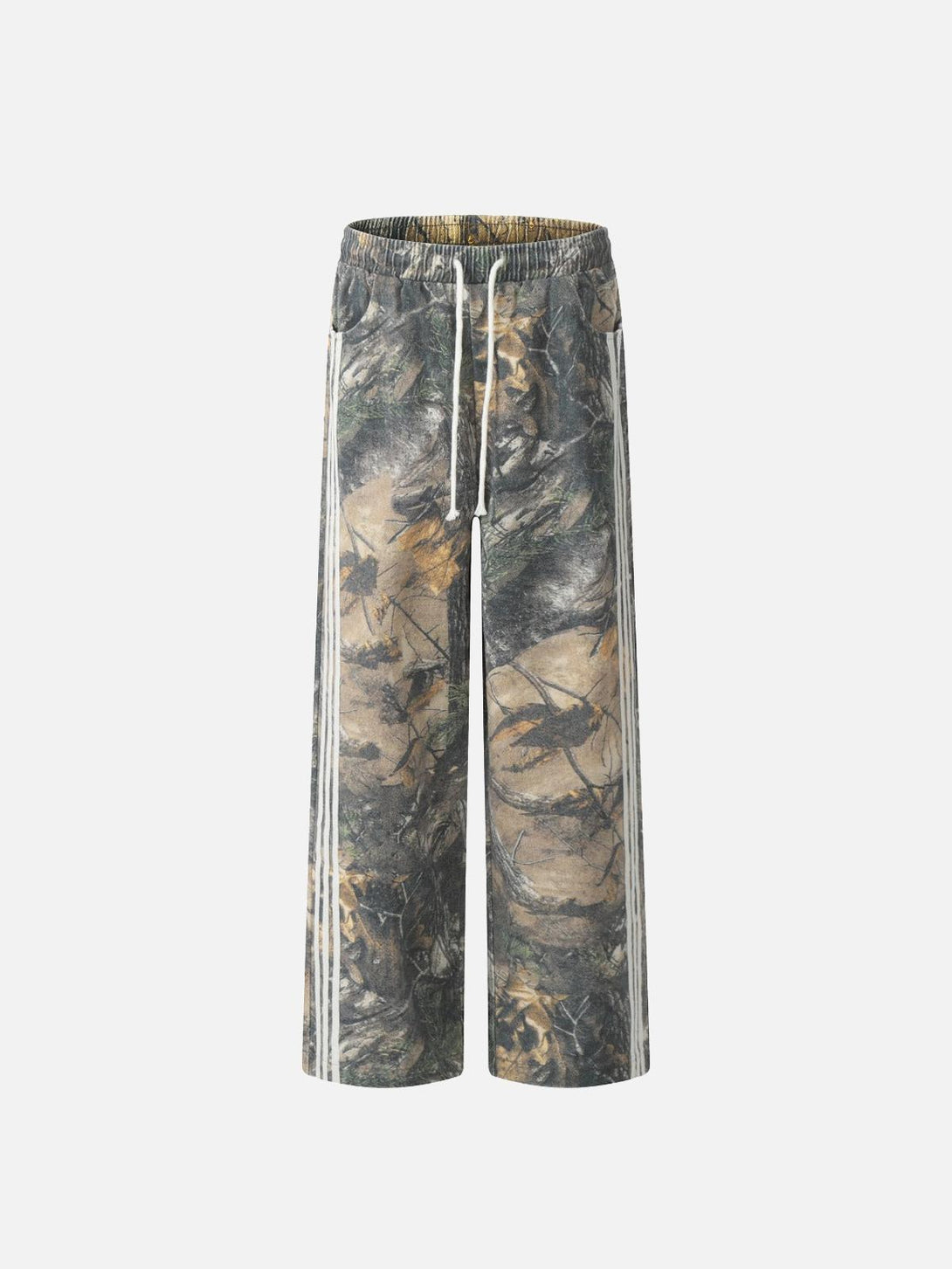 Front view of TALISHKO drapey pants in a tree branch digital print, featuring earthy green tones.