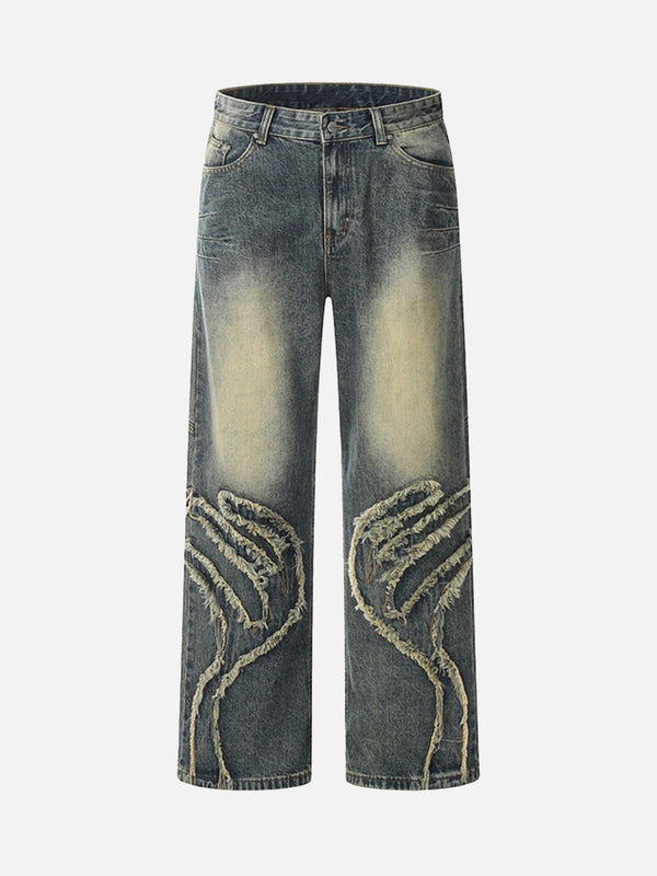 Front view of vintage baggy jeans featuring unique distressed detailing by TALISHKO.