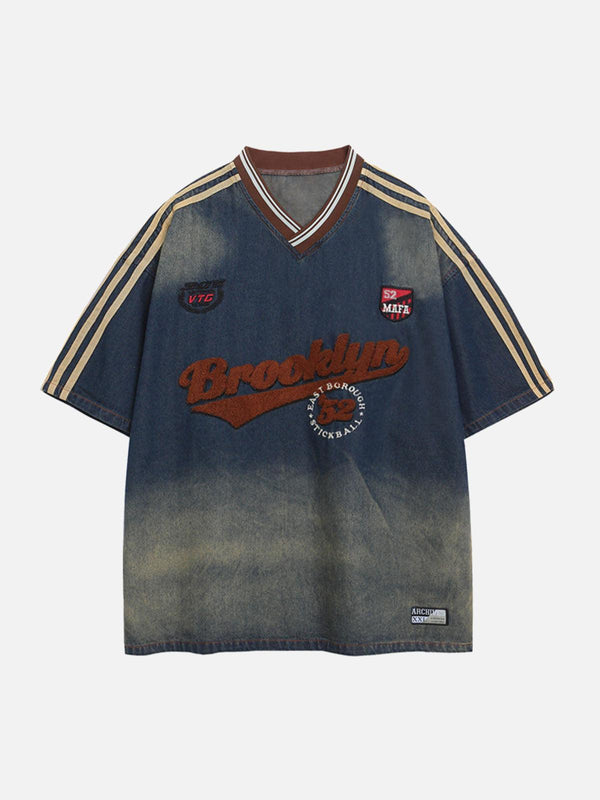 Front view of TALISHKO's vintage denim T-shirt in dark blue with gradient wash and retro details.