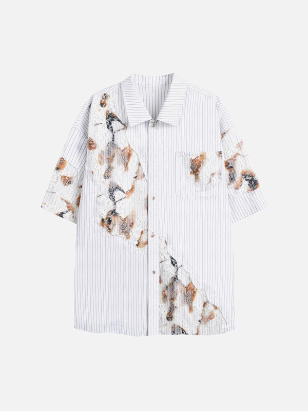 Front view of a white denim shirt by TALISHKO, featuring vintage embroidered floral accents.