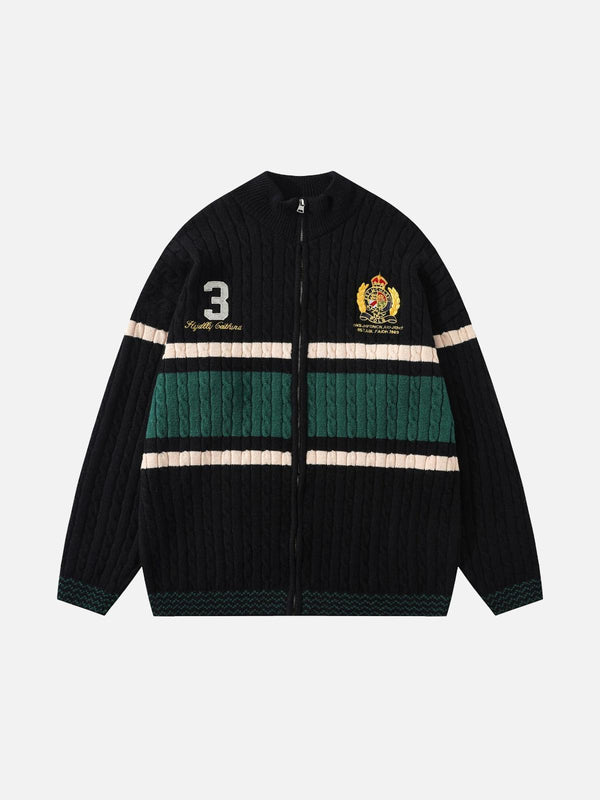 Front view of a black vintage sweater with bold embroidery by TALISHKO, featuring green and beige stripes.