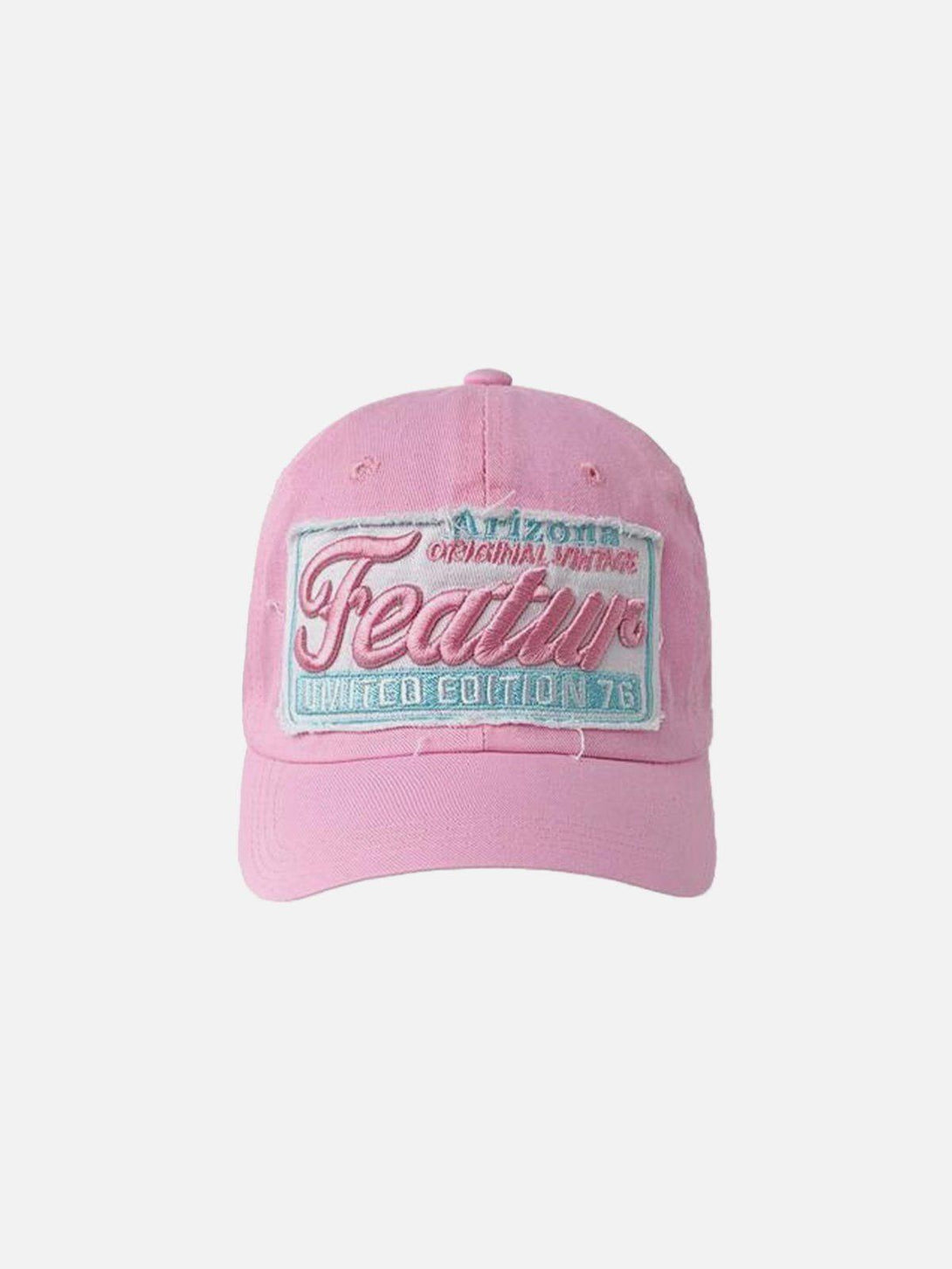 Front view of a pink vintage embroidery cap by TALISHKO, highlighting its unique patch design.