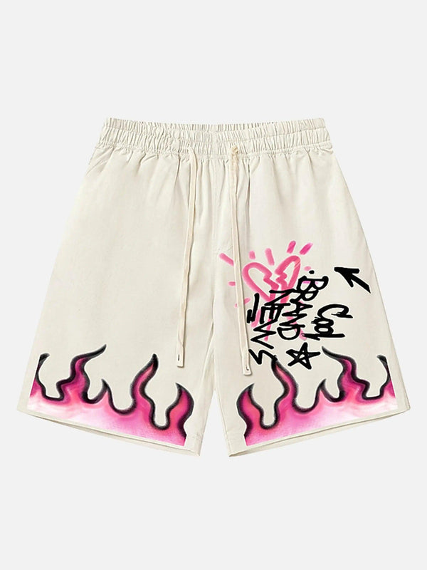 Front view of TALISHKO apricot shorts, featuring vibrant flame design and graffiti accents.