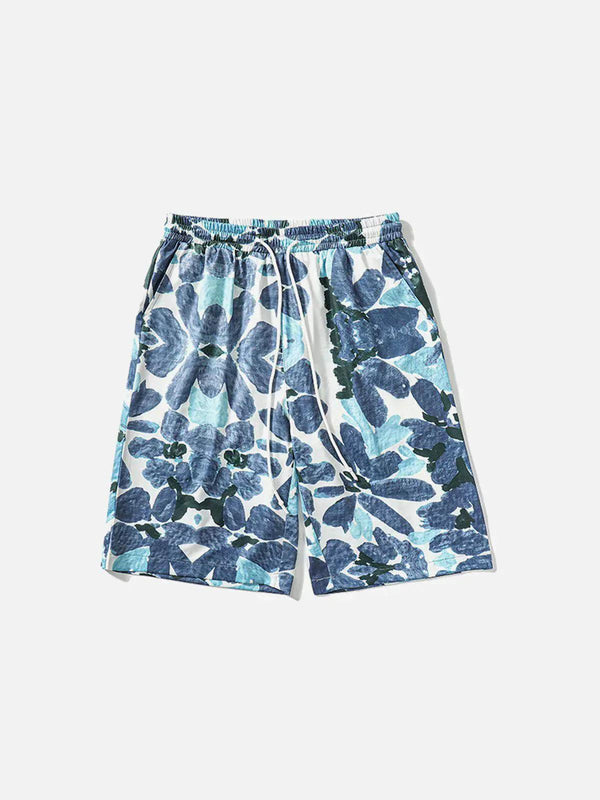 Front view of TALISHKO beach shorts with a vintage blue floral oil painting pattern.