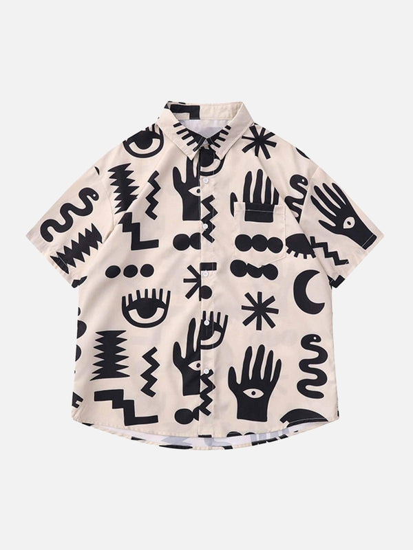 Front view of a beige short sleeve shirt with bold black abstract prints by TALISHKO.