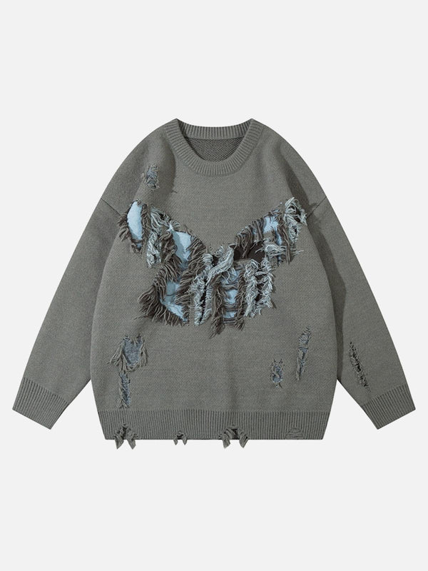 Front view of a gray, ripped butterfly sweater by TALISHKO, showcasing a unique street style.