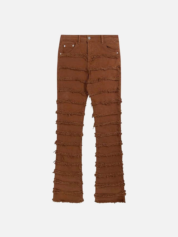 Front view of TALISHKO brown slim jeans featuring layered raw edges for a vintage street style.