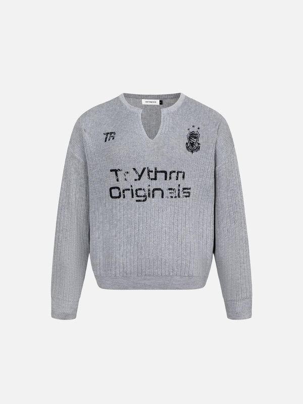 A gray vintage-style V-neck sweater by TALISHKO, featuring bold lettering and a cozy fit.