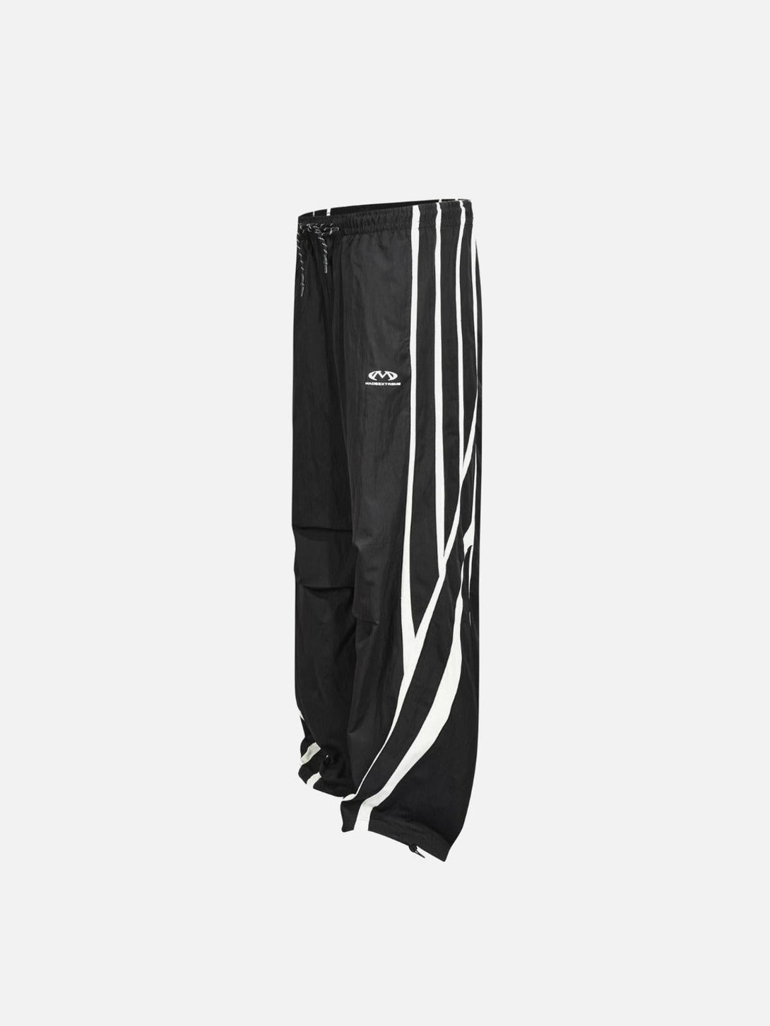 Side view of black TALISHKO vintage sweatpants featuring bold white stripes for a stylish look.