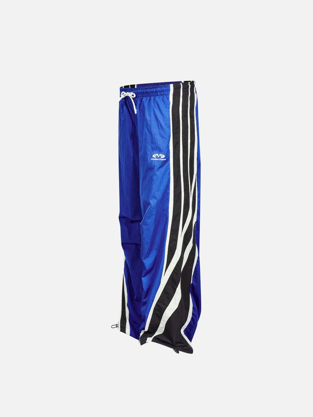 Blue TALISHKO vintage sweatpants with bold black and white side stripes in front view.