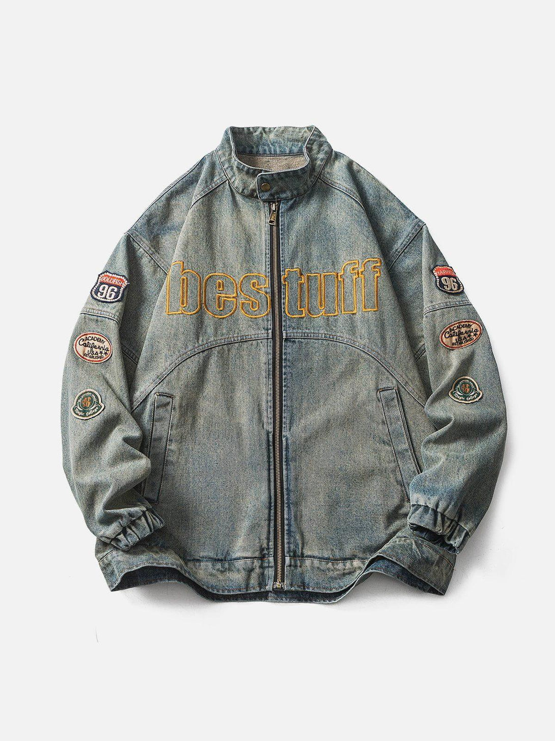 Front view of a blue vintage racing denim jacket by TALISHKO with bold patches and embroidery.