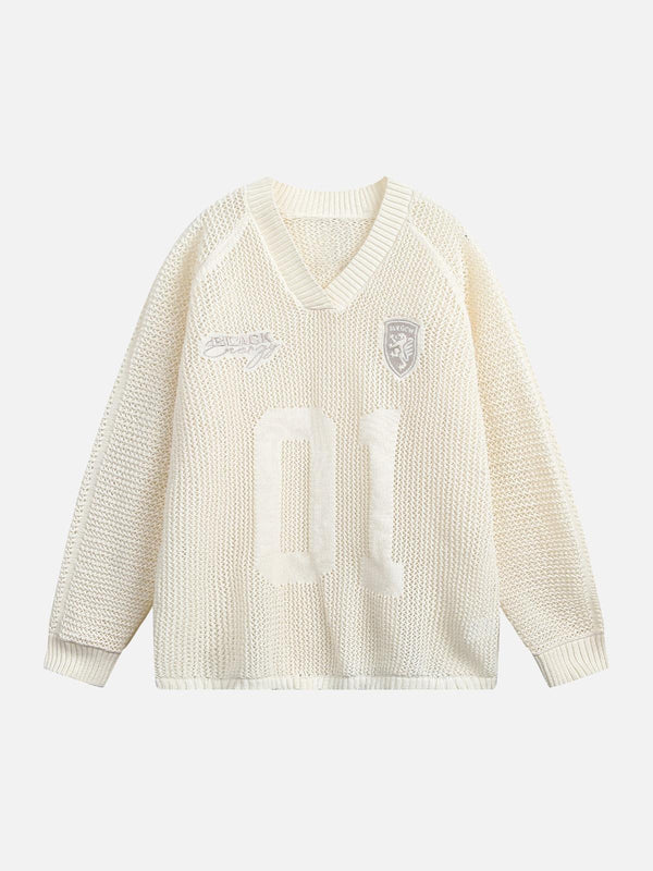 Front view of apricot V-neck knitted sweater by TALISHKO, featuring vintage-inspired details.