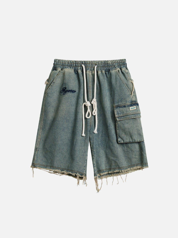 Front view of blue washed fringe jorts by TALISHKO, perfect for casual summer style.
