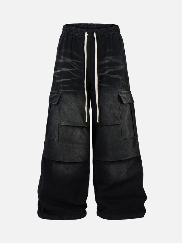 Black cargo jeans with drawstring by TALISHKO, featuring a front view and multiple pockets.