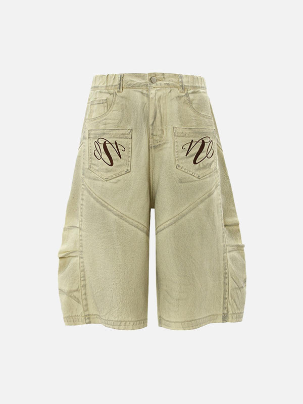 Back view of apricot baggy denim shorts by TALISHKO featuring stylish pocket embroidery.