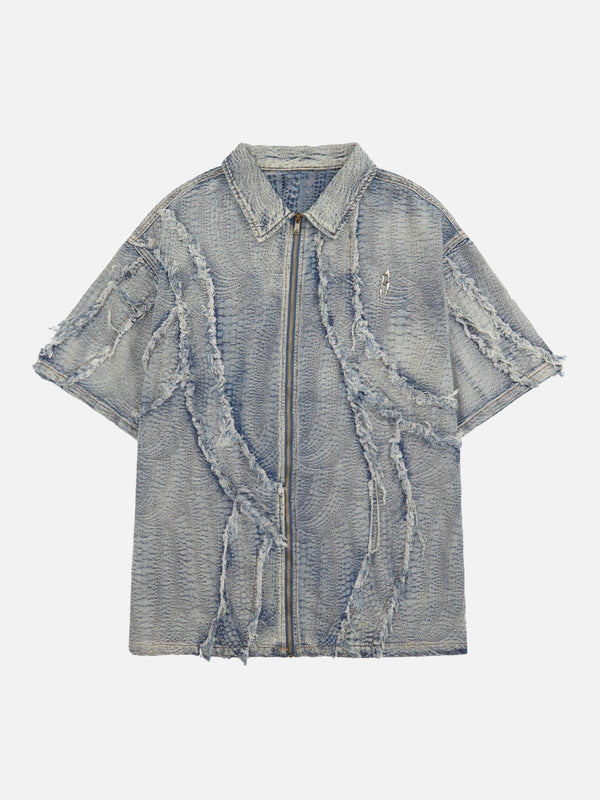 Front view of a blue washed denim shirt by TALISHKO with raw edges and textured details.