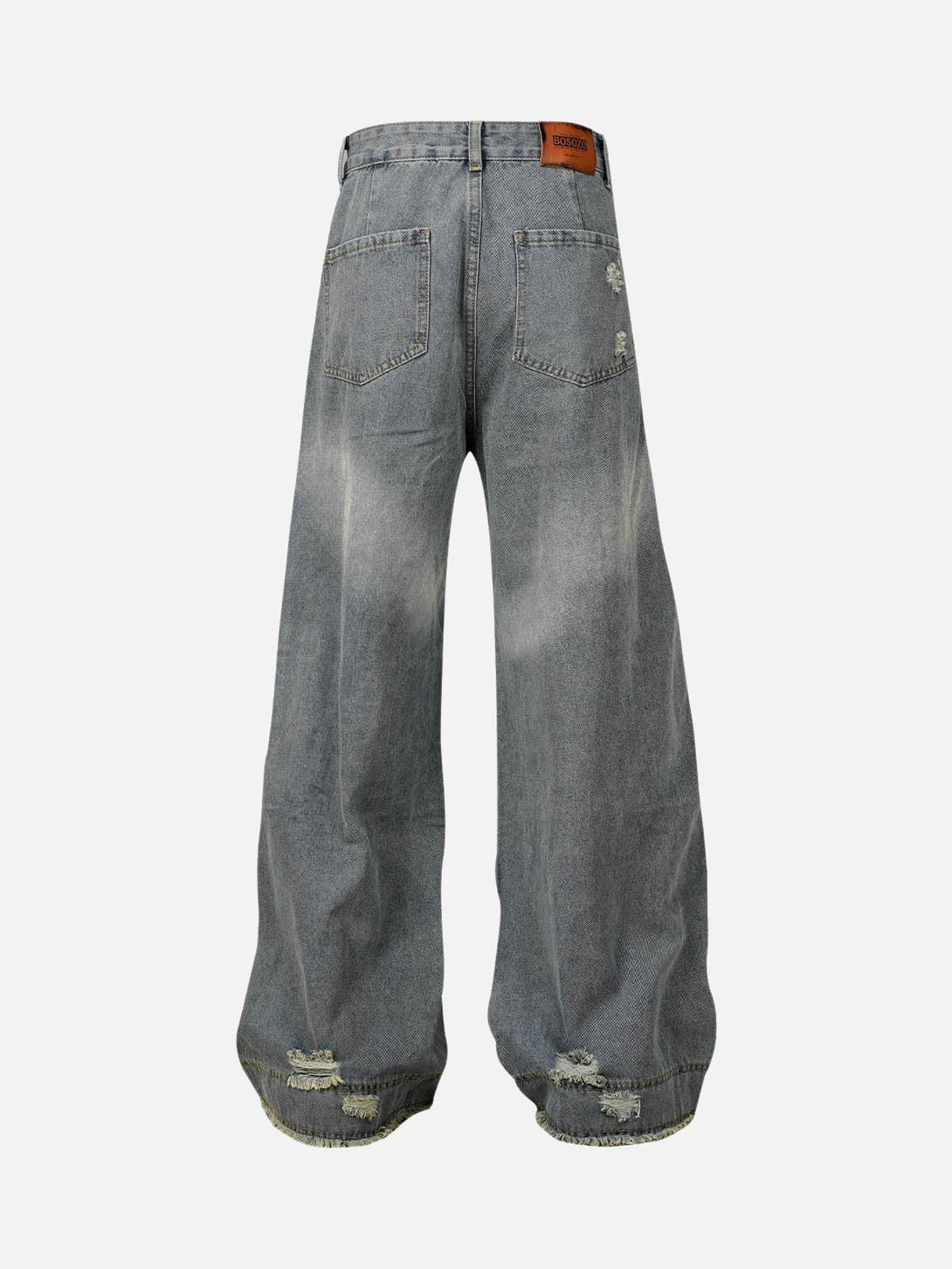 Back view of washed light blue baggy jeans by TALISHKO, featuring a relaxed, ripped design.